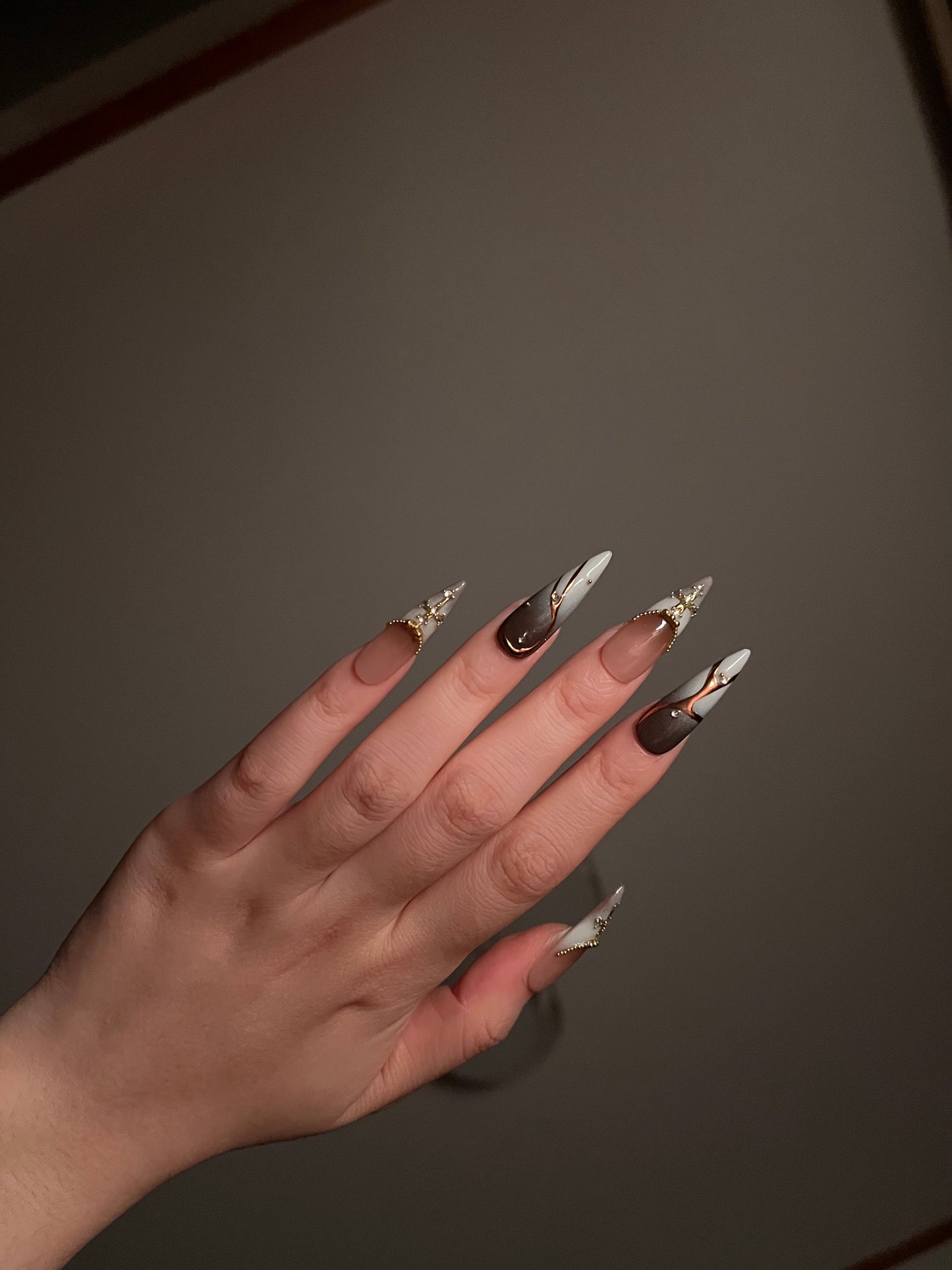 Gilt Cross Masonry Brown Gradient Almond Nail Design